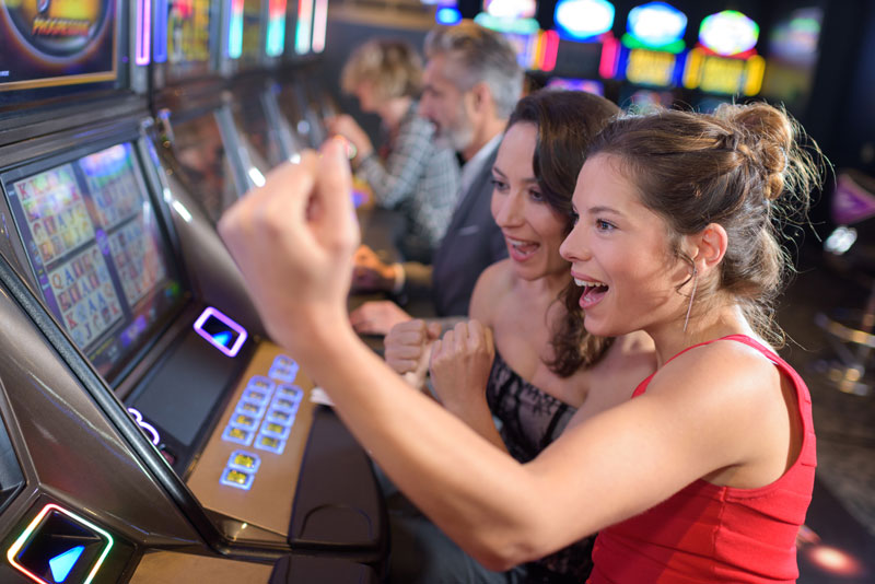 people playing slots and winning